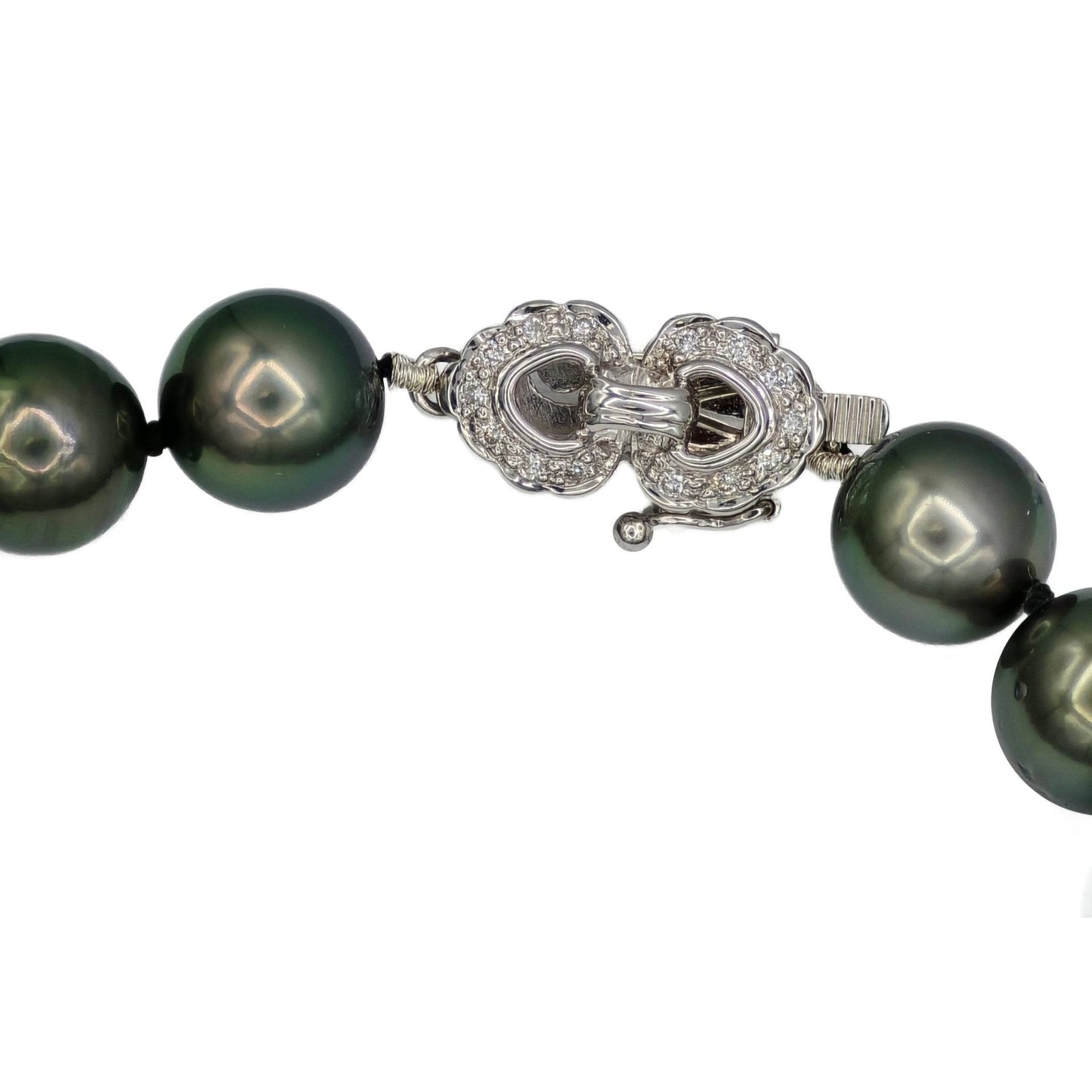Closeup of 14K white diamond clasp on Tahitian pearl strand