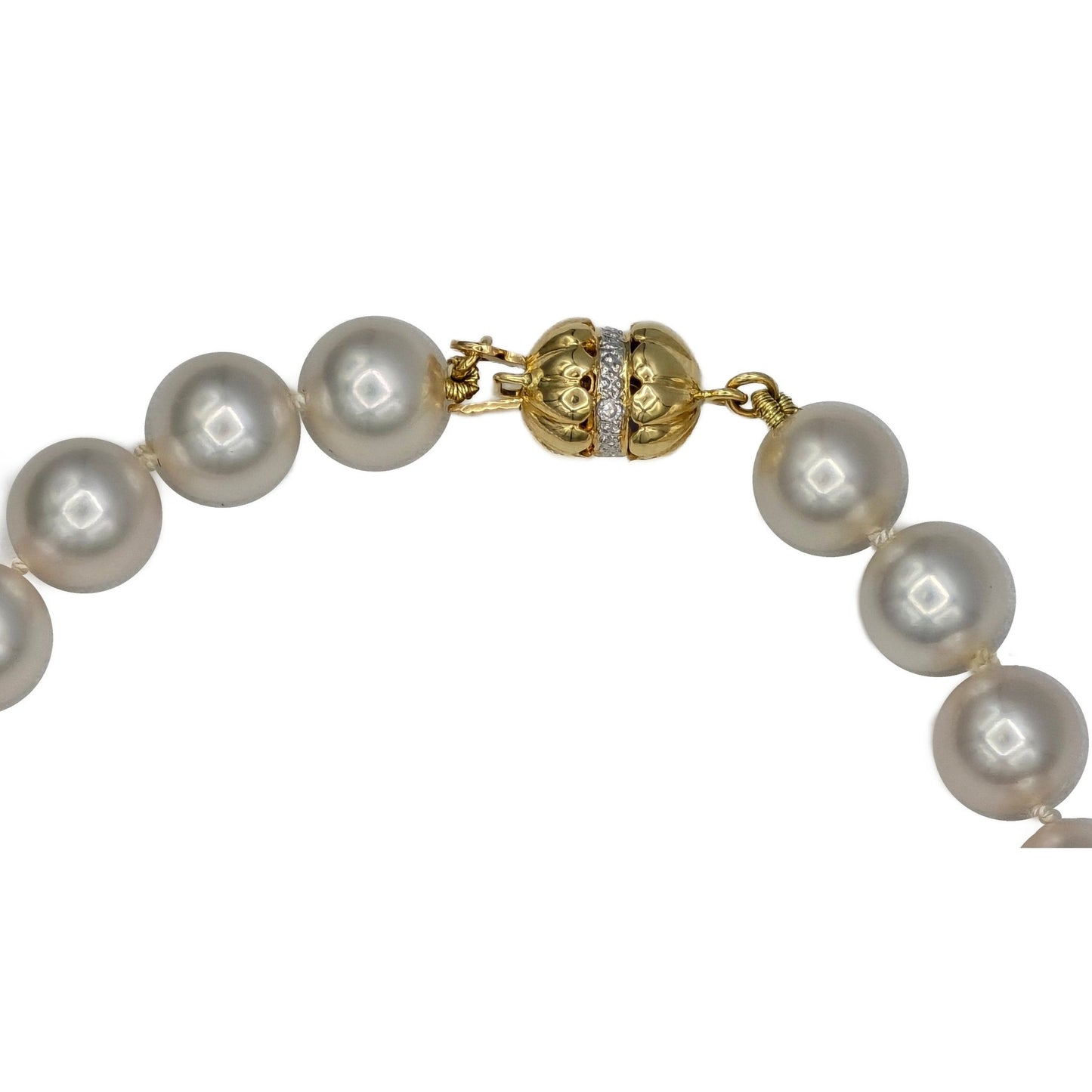 Closeup of 14K yellow gold clasp akoya pearl strand