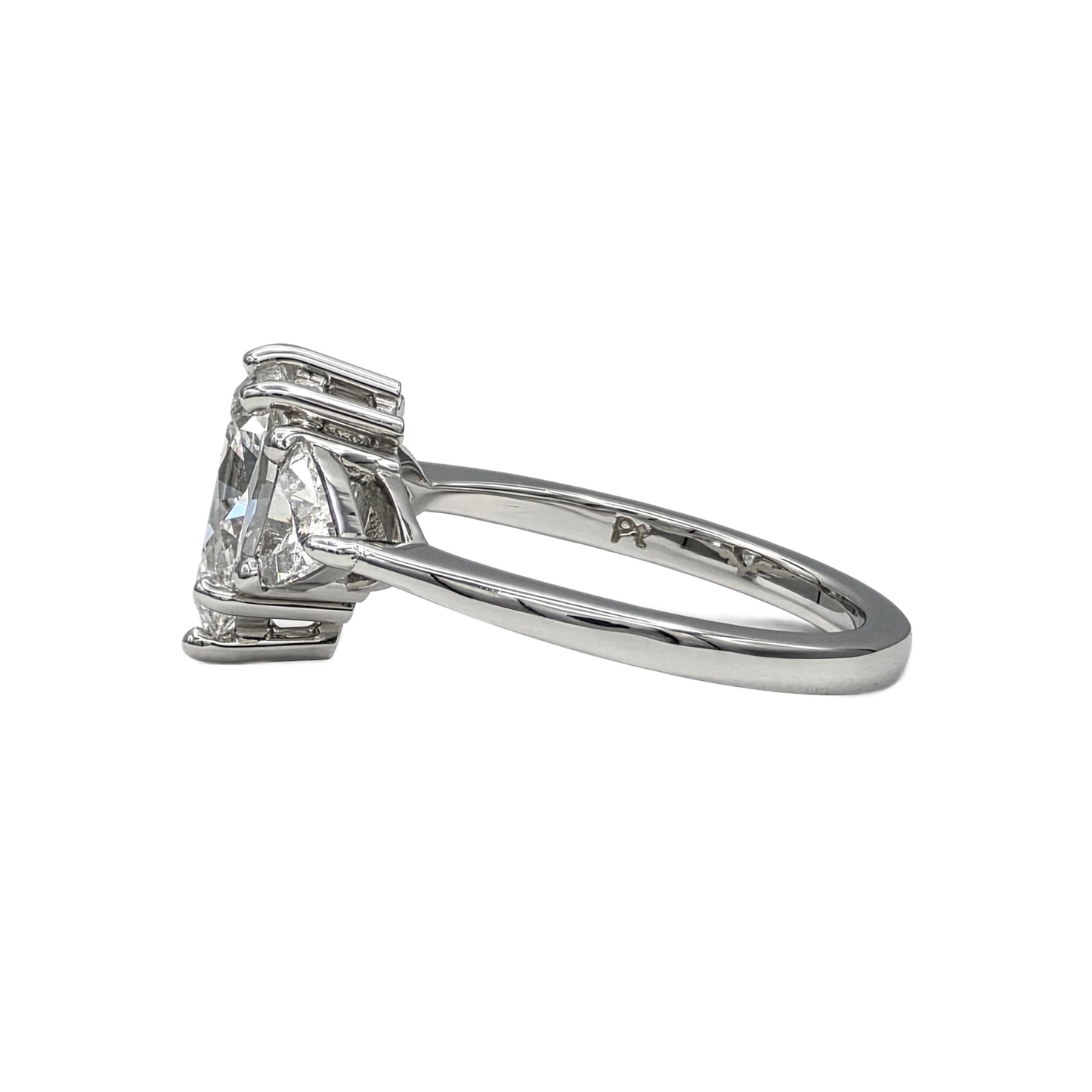 1.85Ct Pear Shape Diamond and trillion 3 stone ring in Platinum