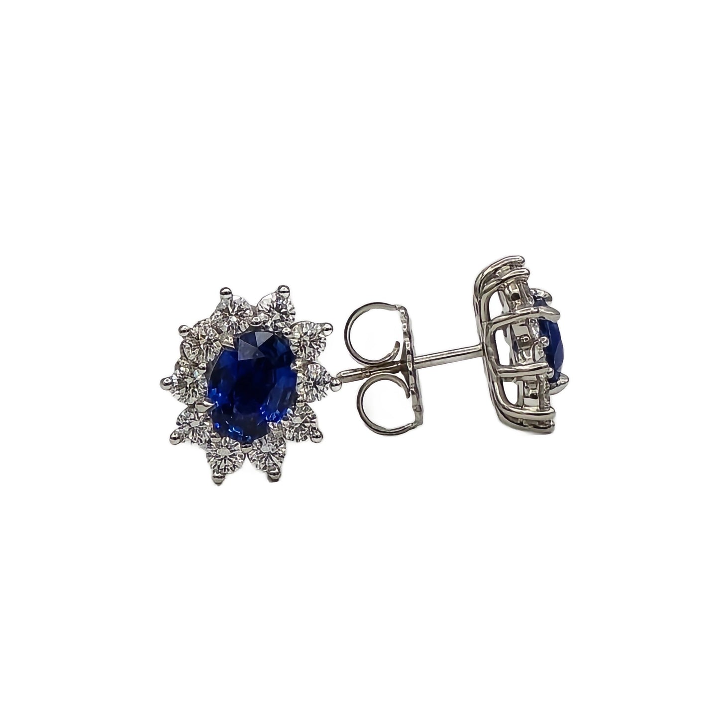 Oval sapphire and diamond halo earrings in platinum