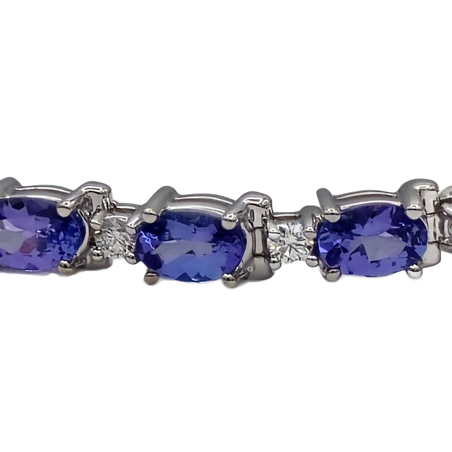 closeup of tanzanite and diamond bracelet in 14K white gold