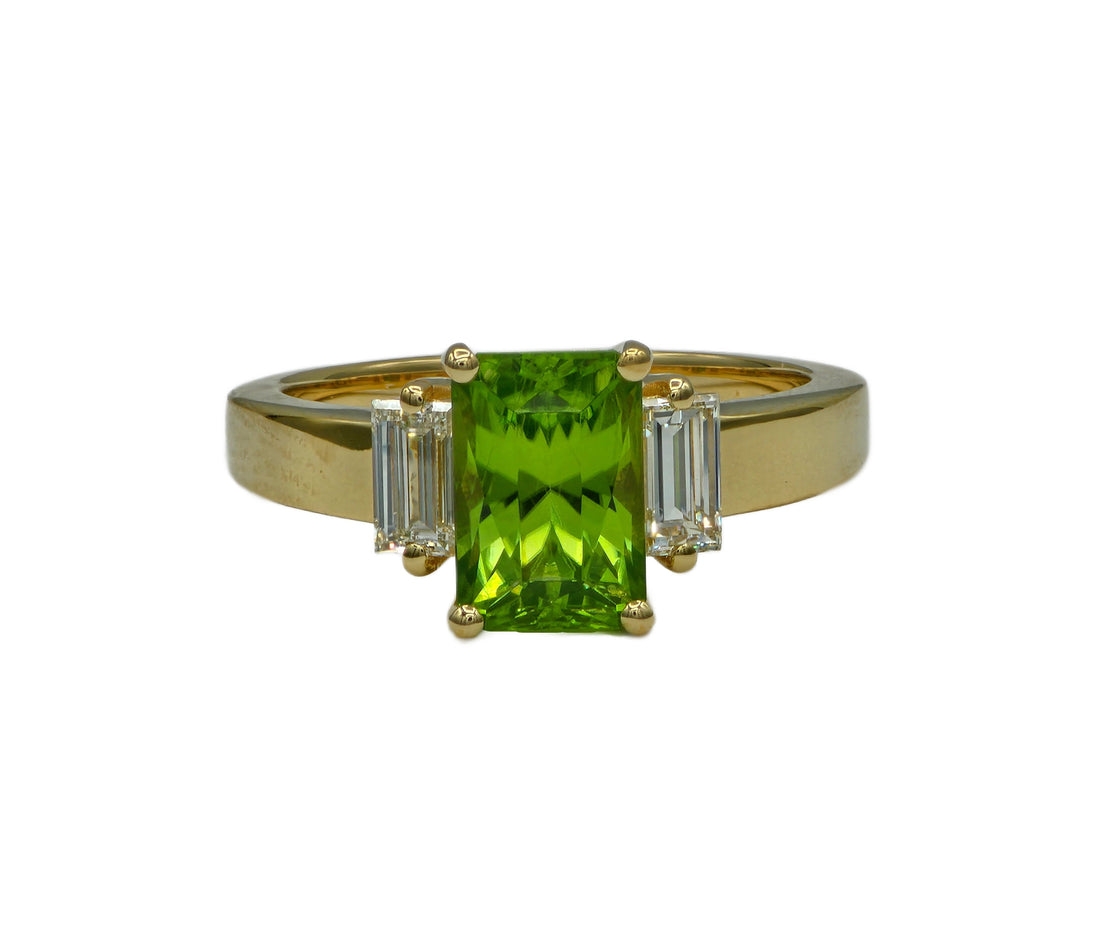 a peridot and diamond ring in 14K yellow gold custom made by Heileman & Company Jewelers