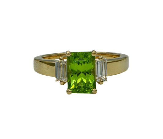 a peridot and diamond ring in 14K yellow gold custom made by Heileman & Company Jewelers
