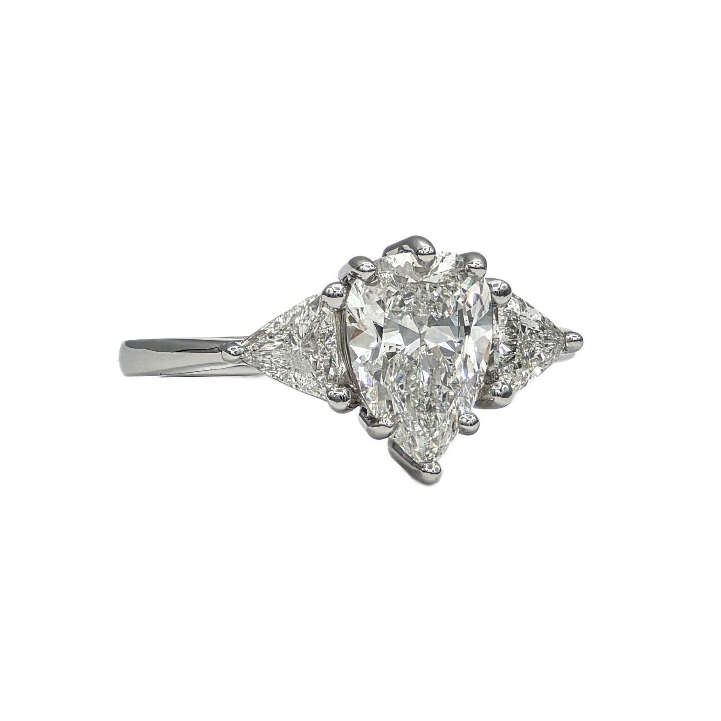 1.85Ct Pear Shape Diamond and trillion 3 stone ring in Platinum