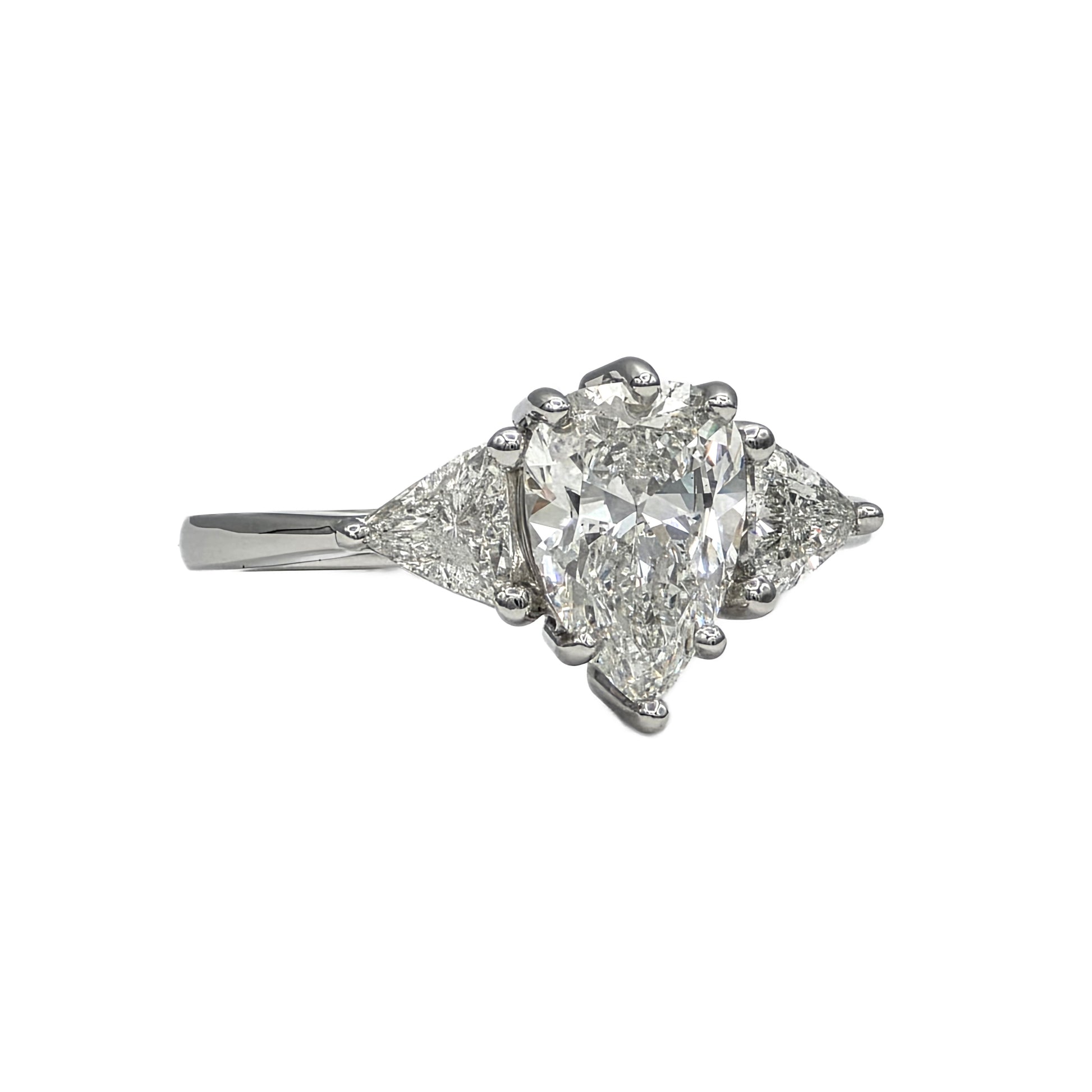 1.85Ct Pear Shape Diamond and trillion 3 stone ring in Platinum