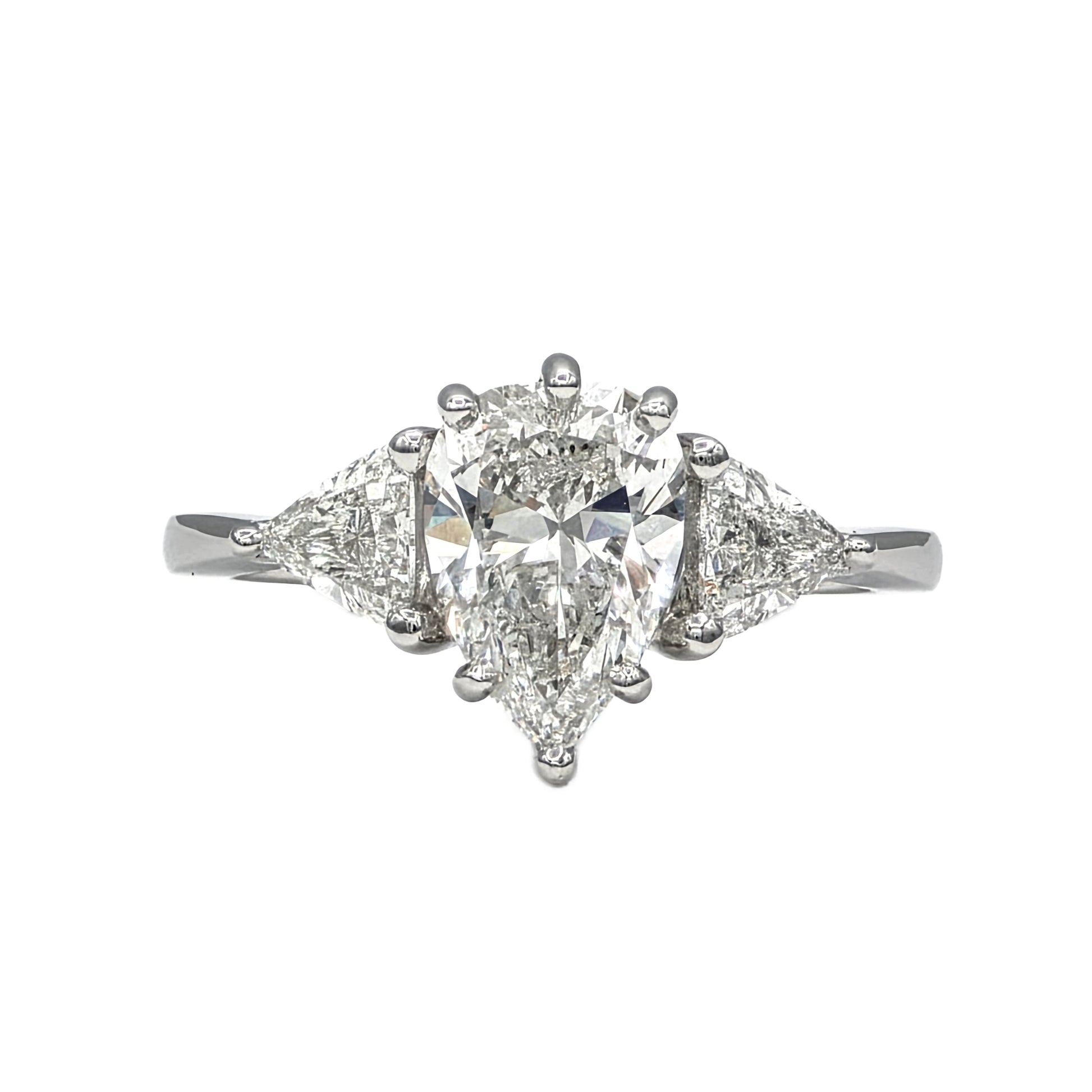 1.85Ct Pear Shape Diamond and trillion 3 stone ring in Platinum