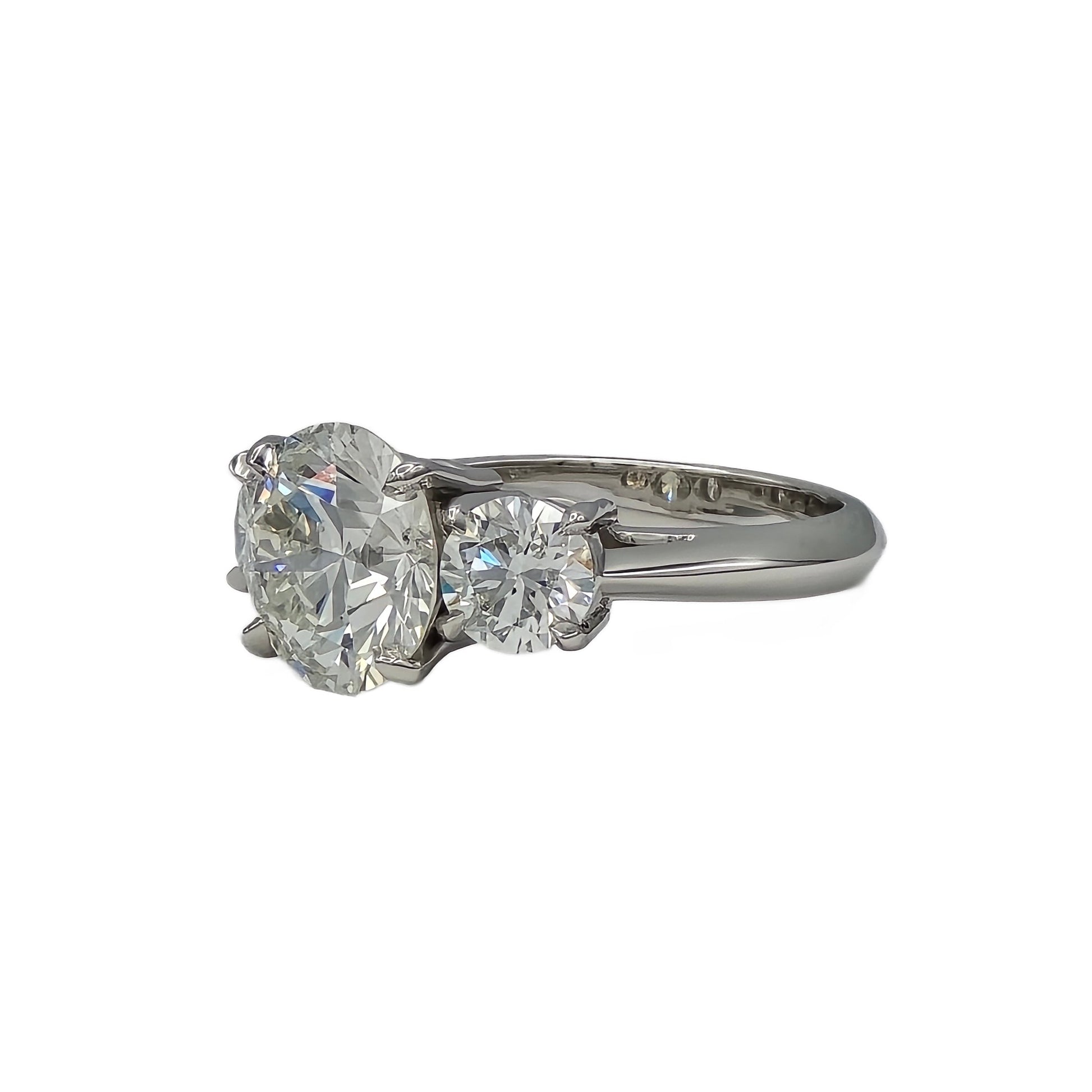 3.47Ct round and 2=1.40ctw round diamond ring in platinum
