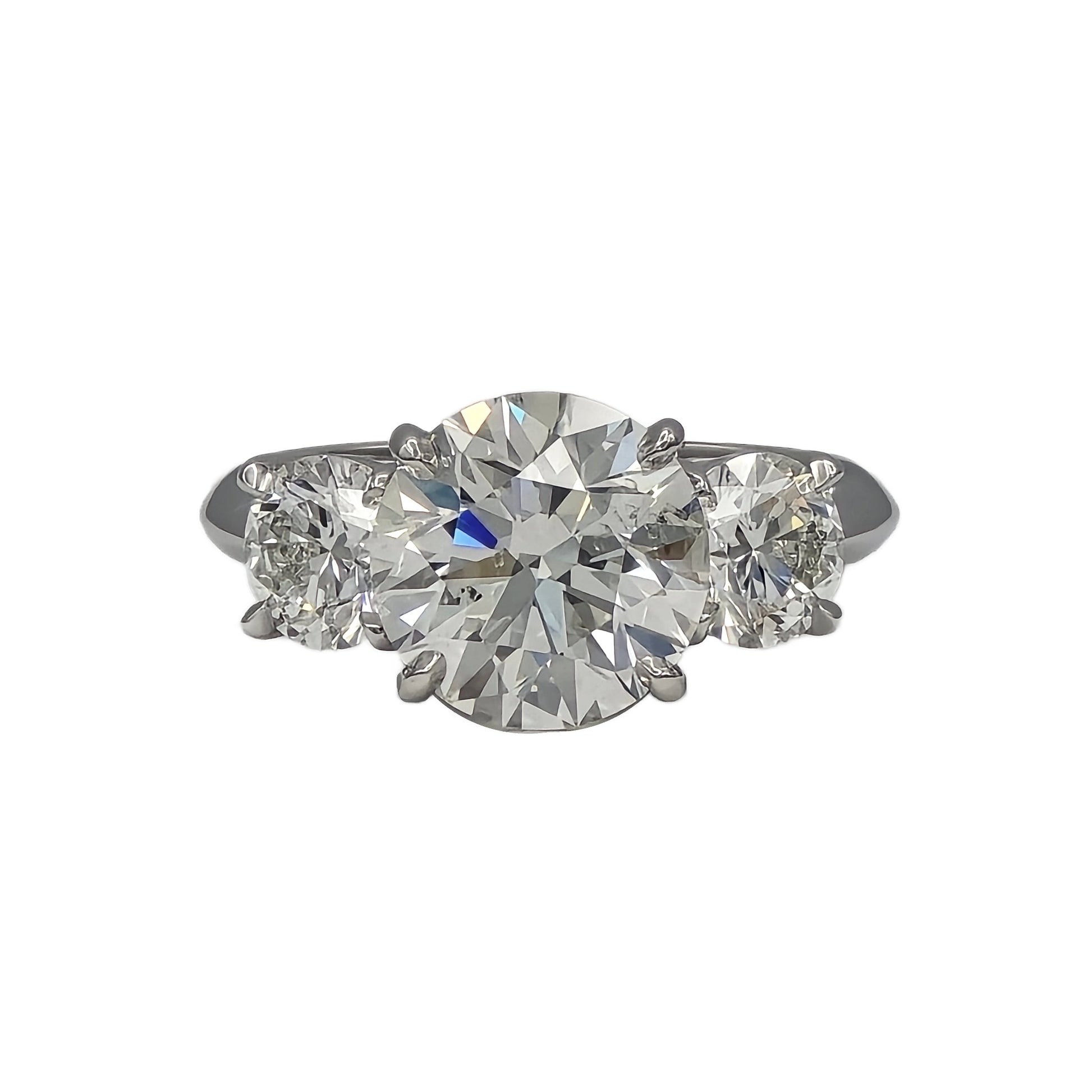 3.47ct and 2=1.40ctw round brilliant cut 3 stone ring in platinum