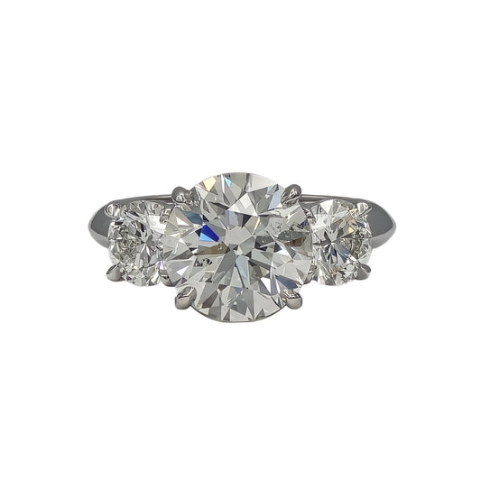 3.47ct and 2=1.40ctw round brilliant cut 3 stone ring in platinum