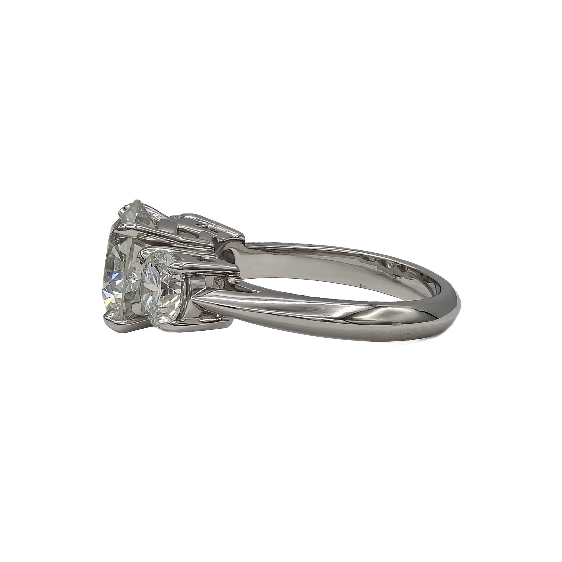 3.27ct and 2=1.40ctw round brilliant cut 3 stone diamond ring in platinum