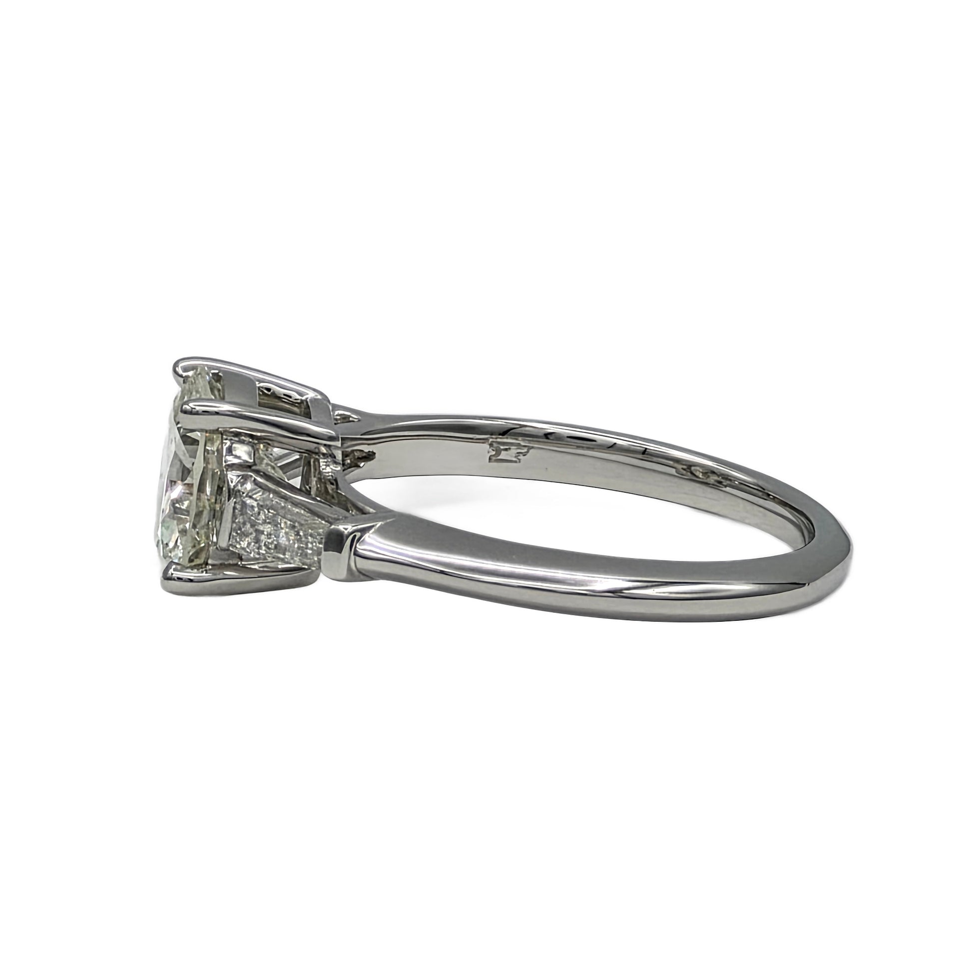 Diamond ring with a white gold band on a white background