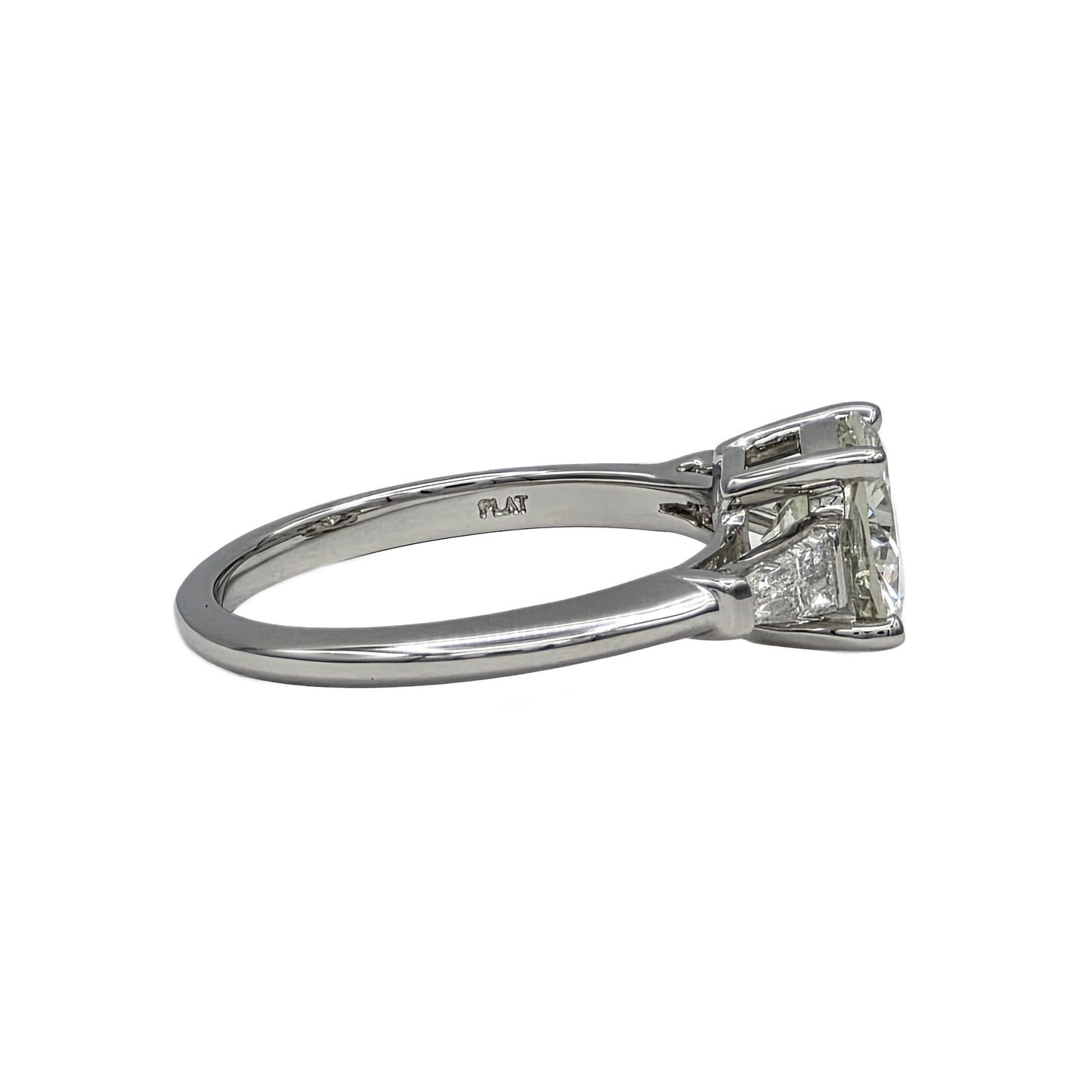 Diamond ring with platinum band on a white background