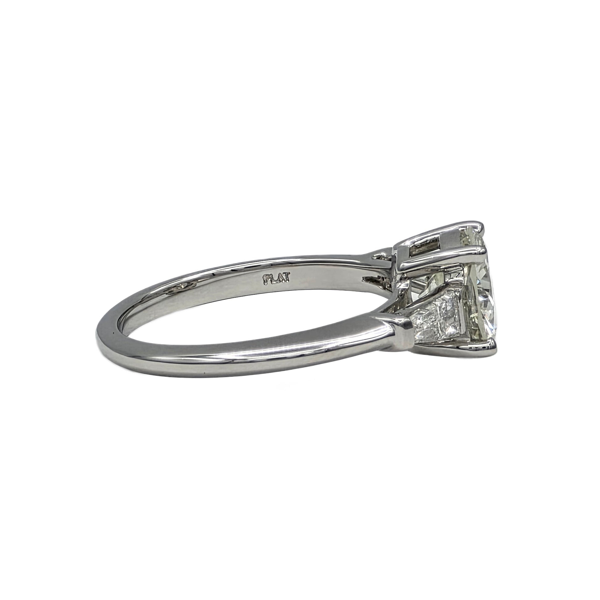 Diamond ring with platinum band on a white background