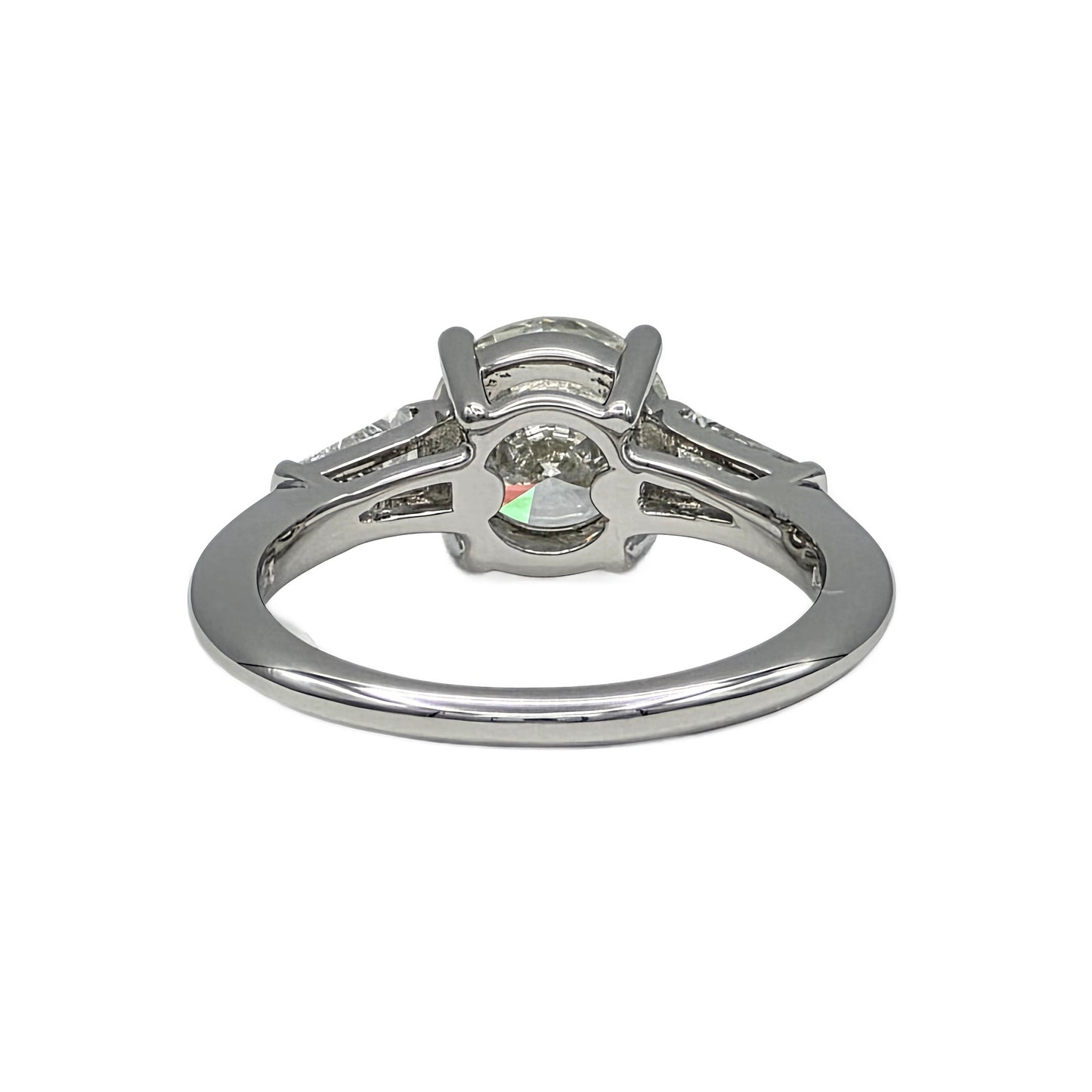 Platinum ring with a diamond on a white background