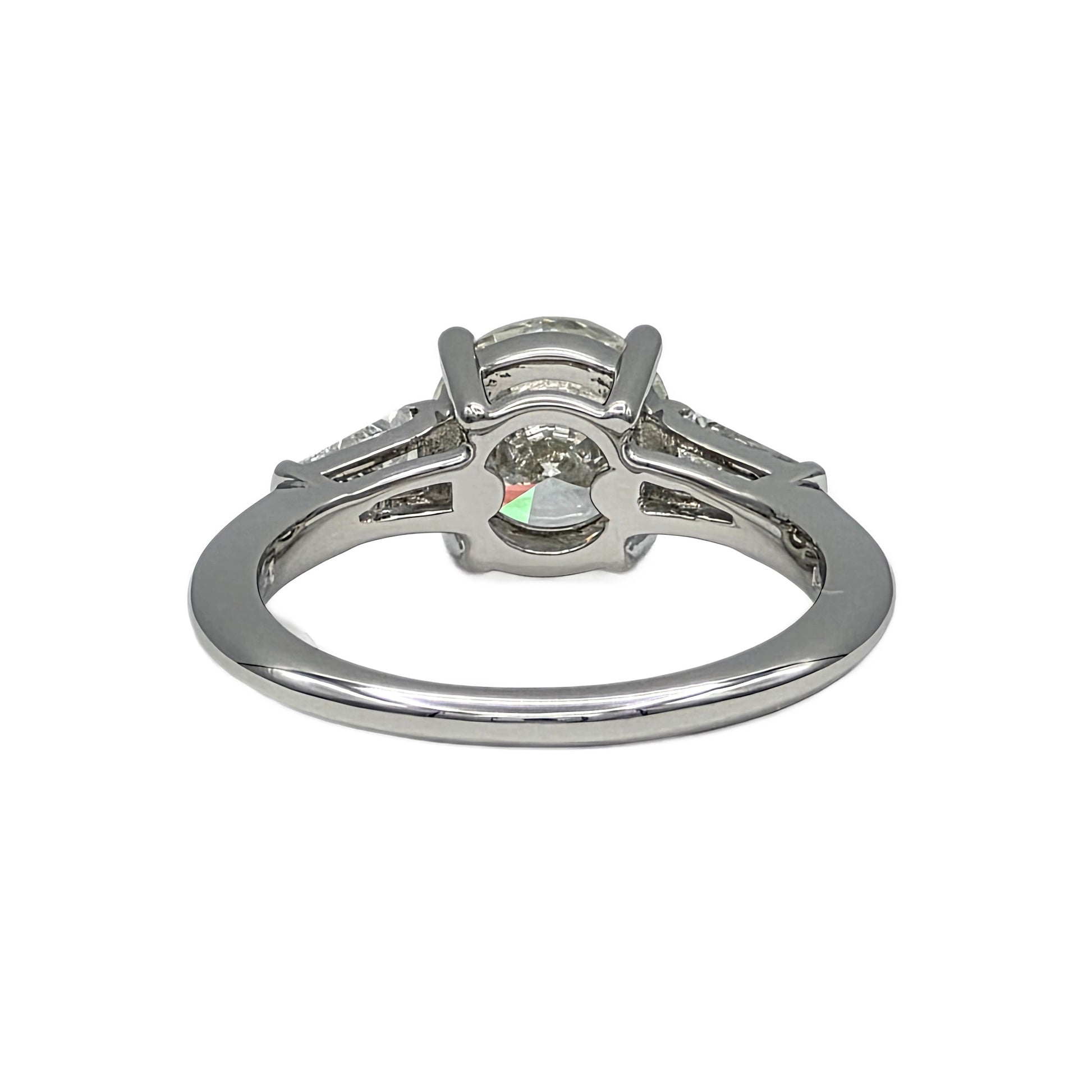 Platinum ring with a diamond on a white background