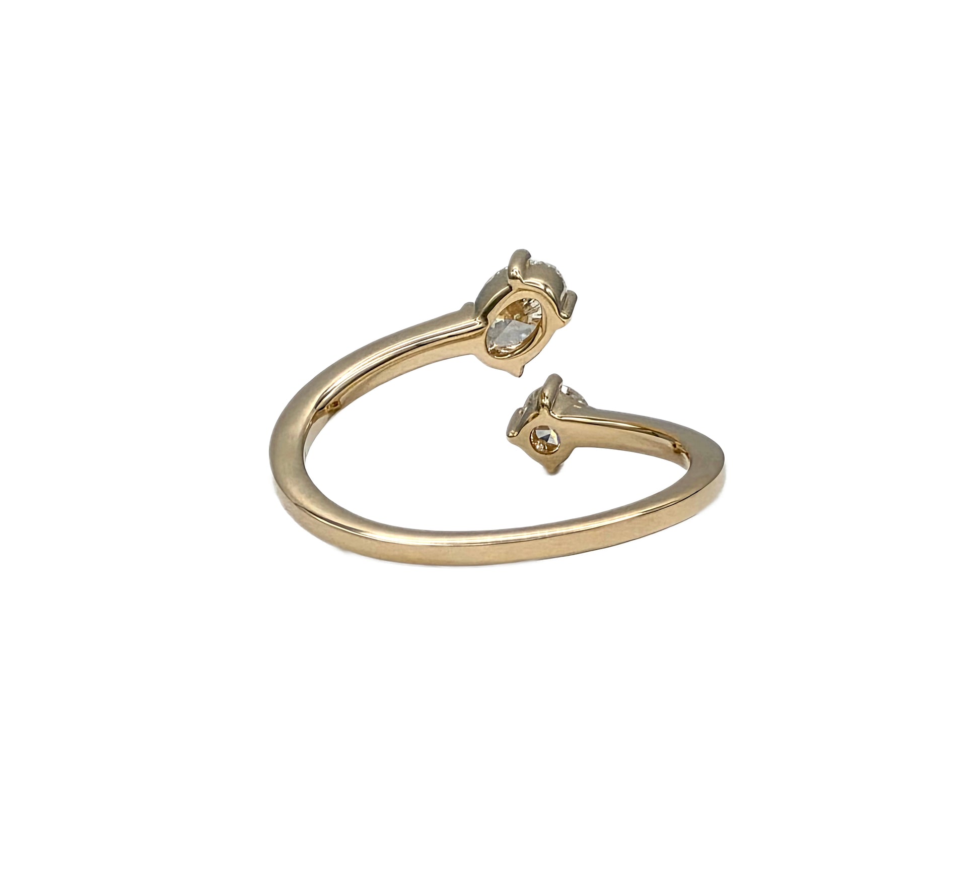 Oval and round diamond bypass ring in 14K yellow gold