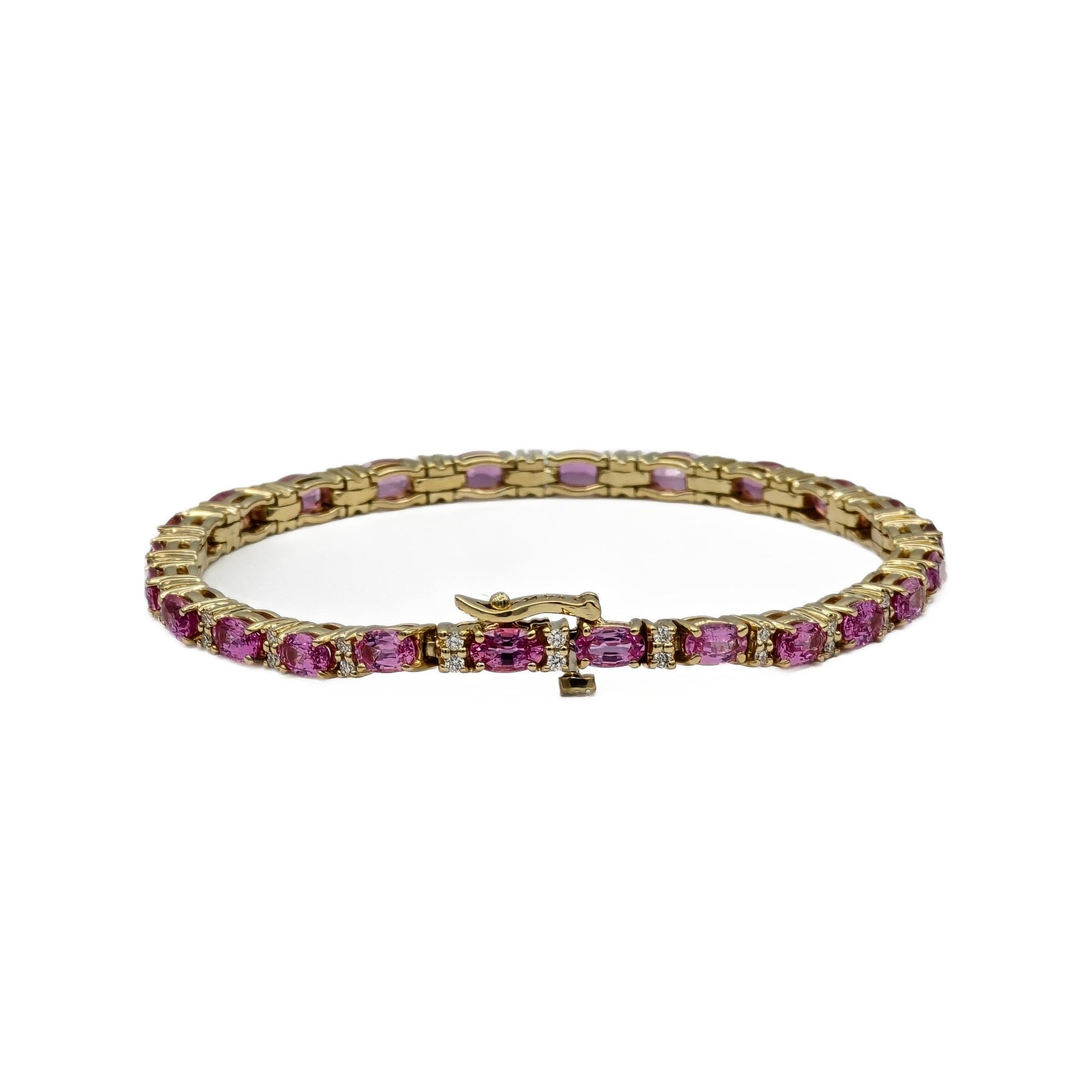 7.25 Carat oval pink sapphire and diamond bracelet in 14k yellow gold