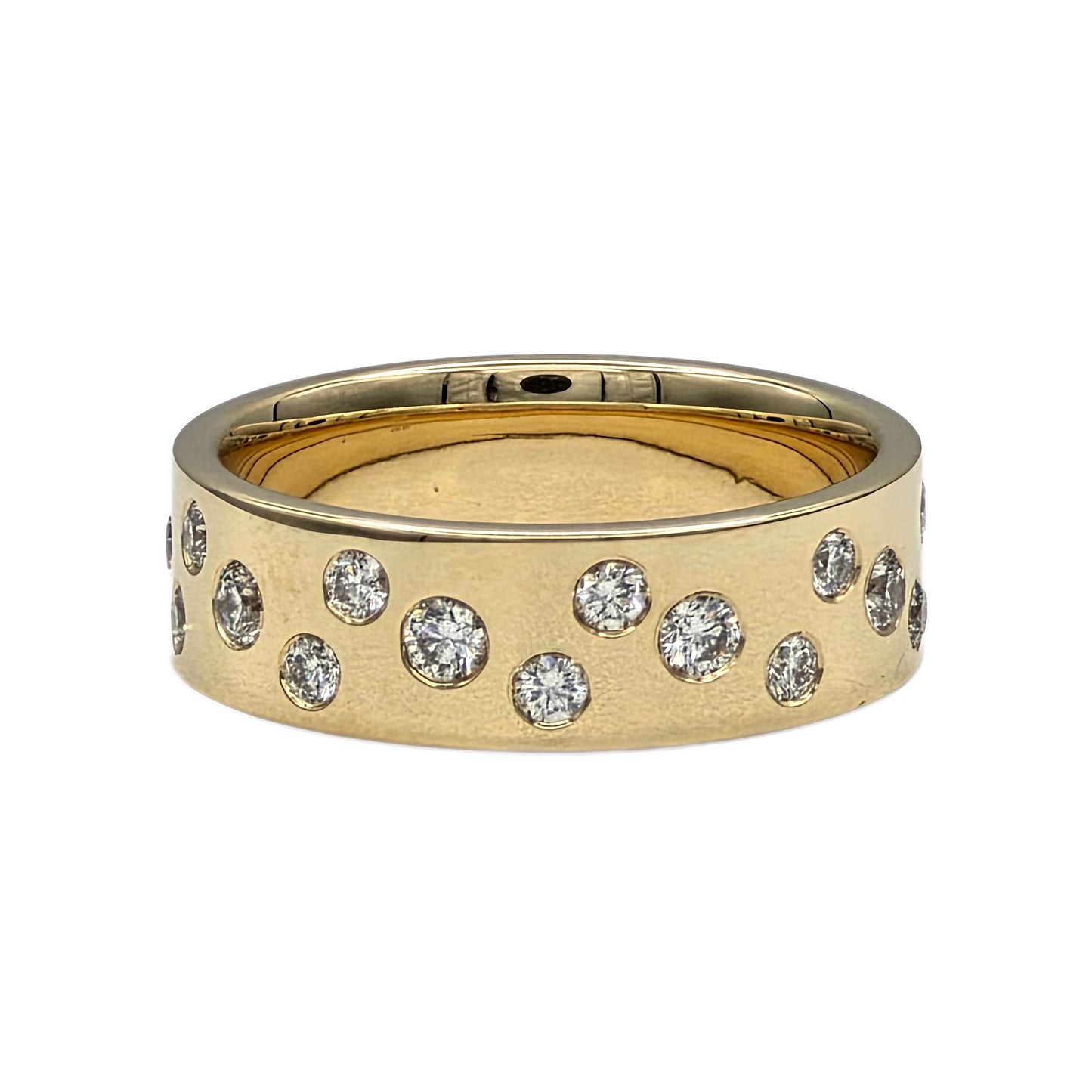 Hammer set round diamond eternity band in 18K yellow gold