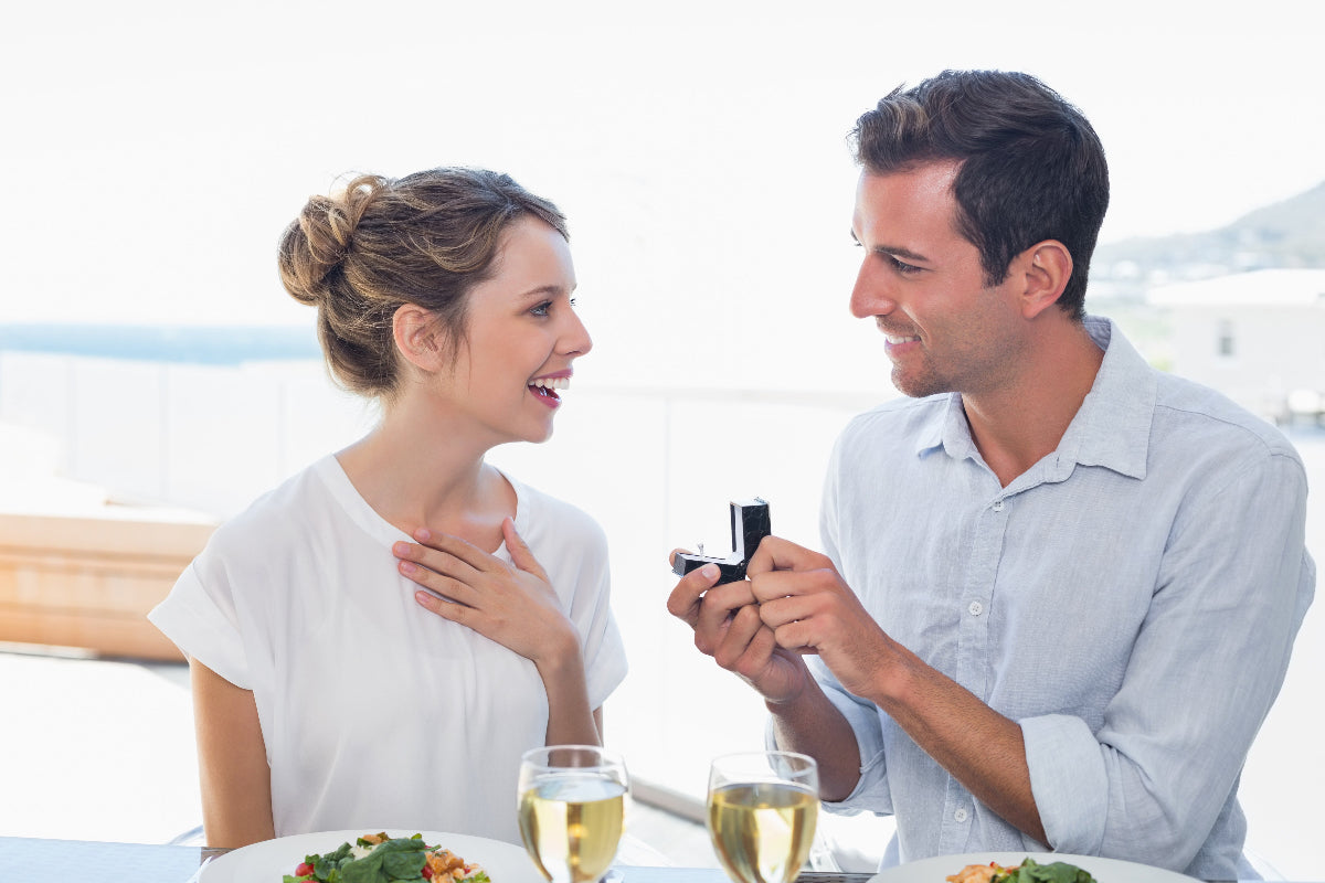 A couple getting engaged at a dinner