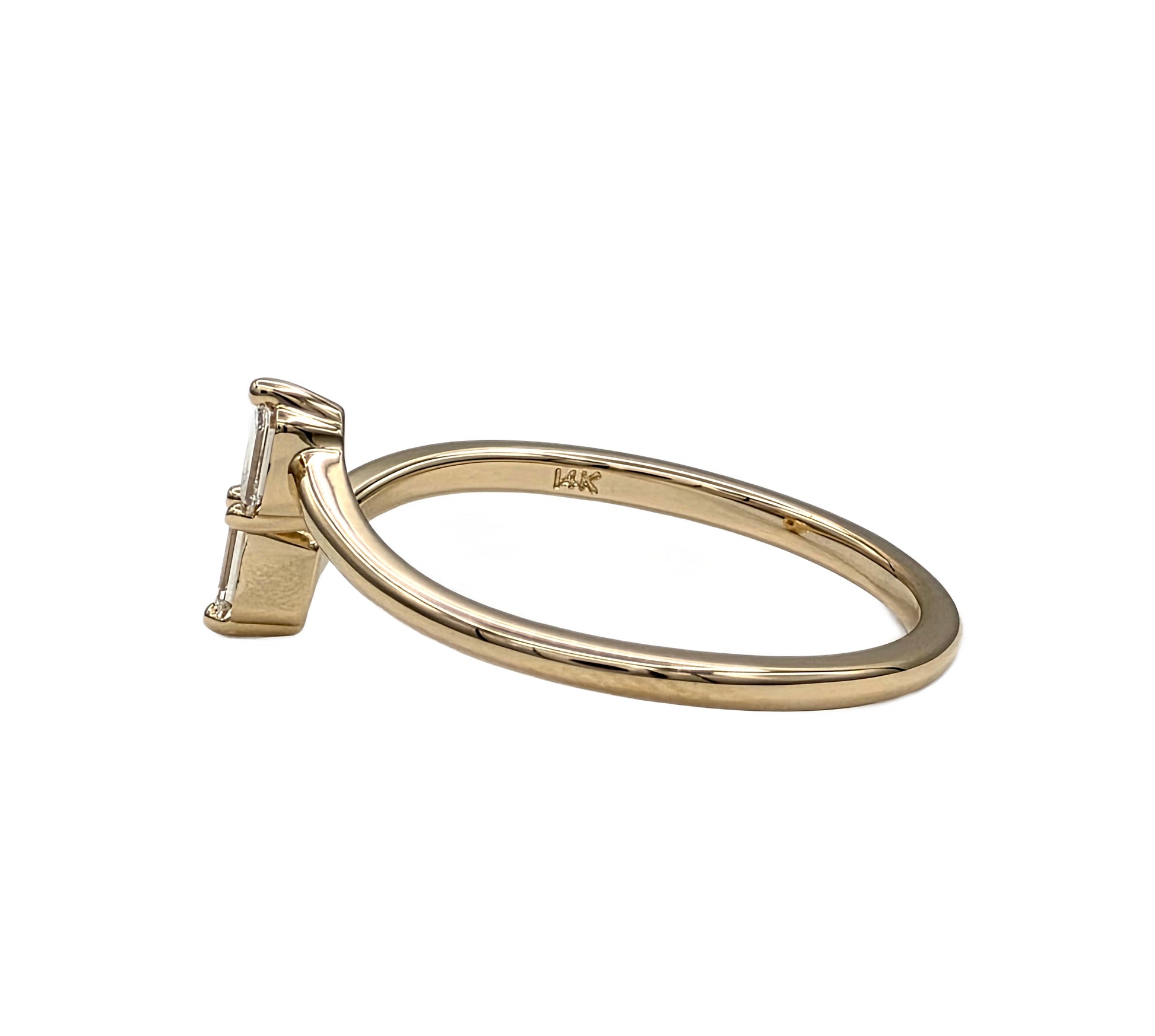 14K yellow gold natural diamond bypass ring with 2 emerald cut diamonds
