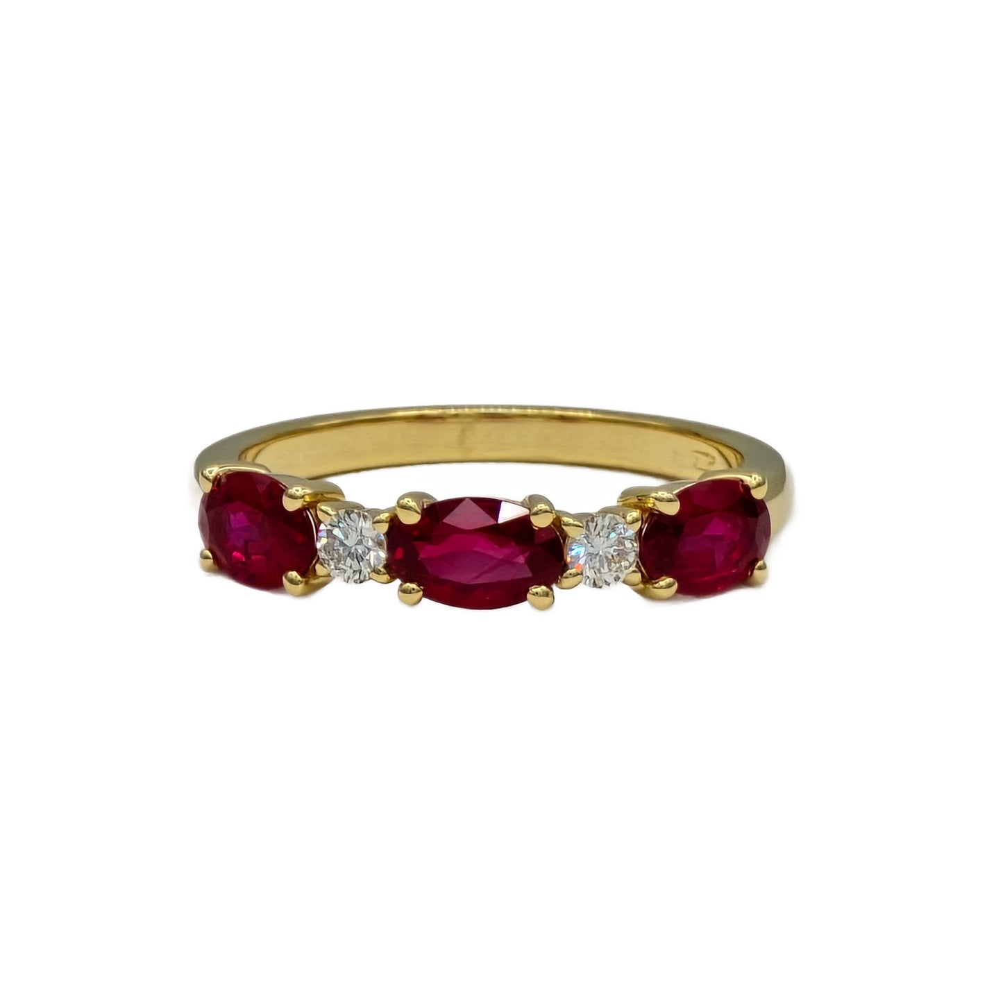 Alternating Oval Ruby and round diamond band in 18K yellow gold
