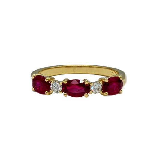 Alternating Oval Ruby and round diamond band in 18K yellow gold
