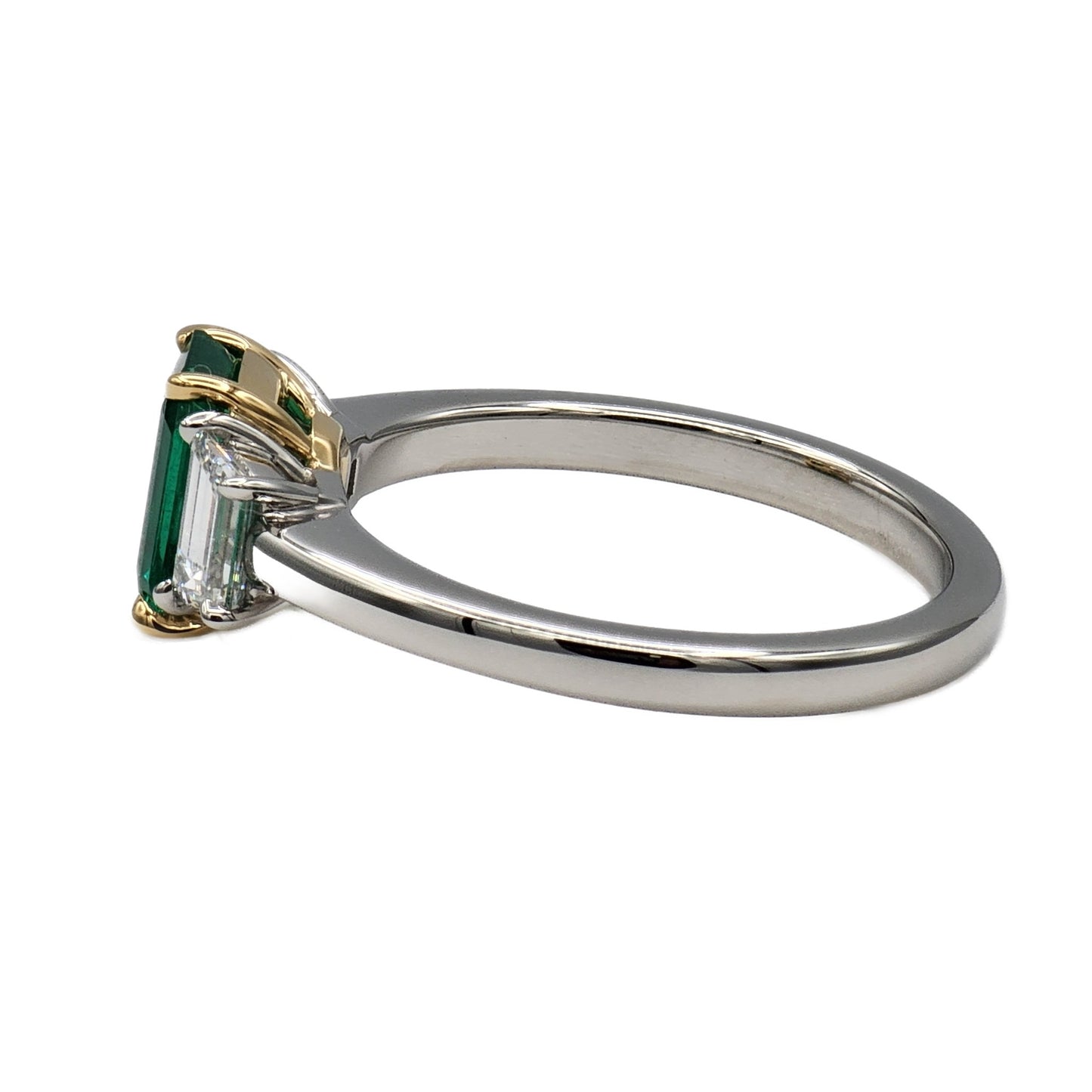 1.10 Carat Emerald Cut Emerald and 2=0.58 Trapezoid Diamond Ring in Platinum and 18K